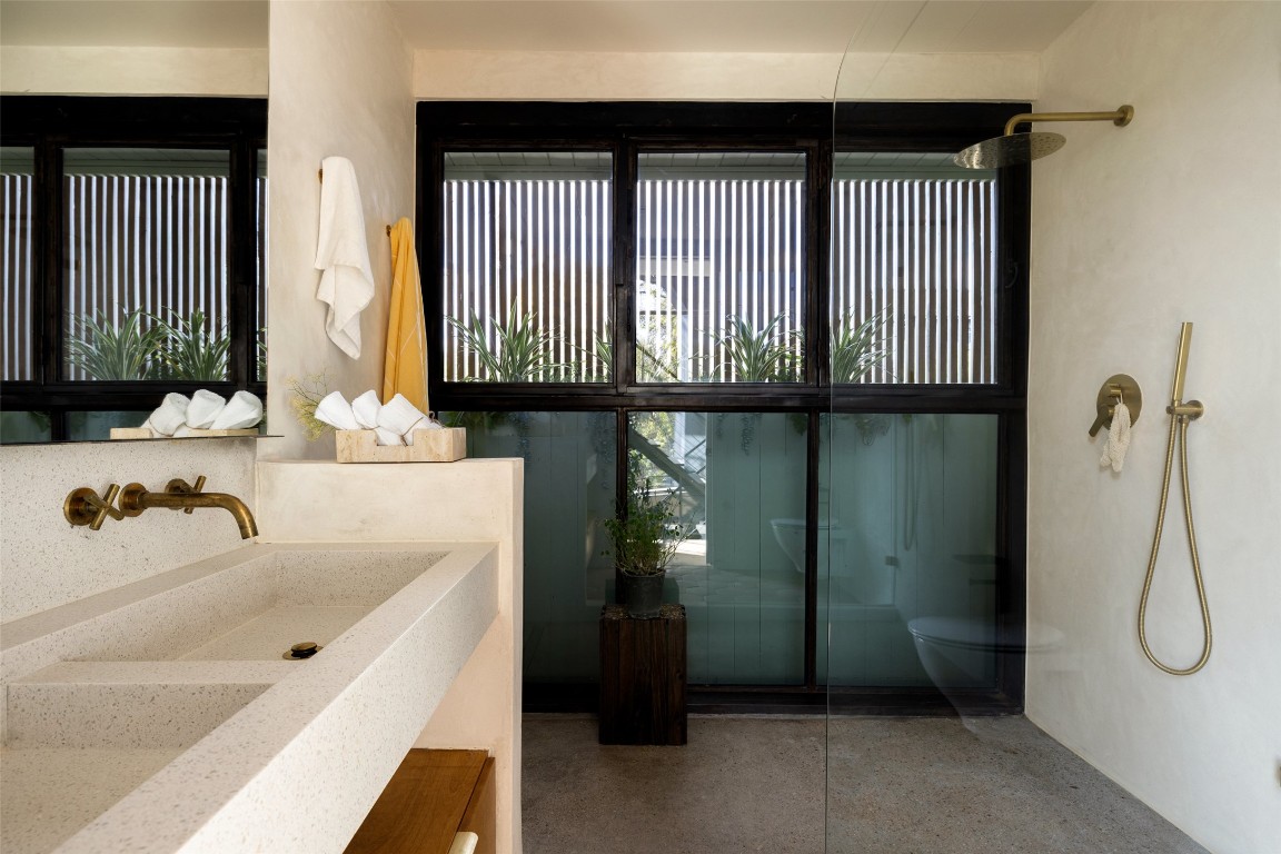 2302 East 11th Street Austin, TX 78702 - Photo 24 of 40 a bathroom with a tub sink and shower