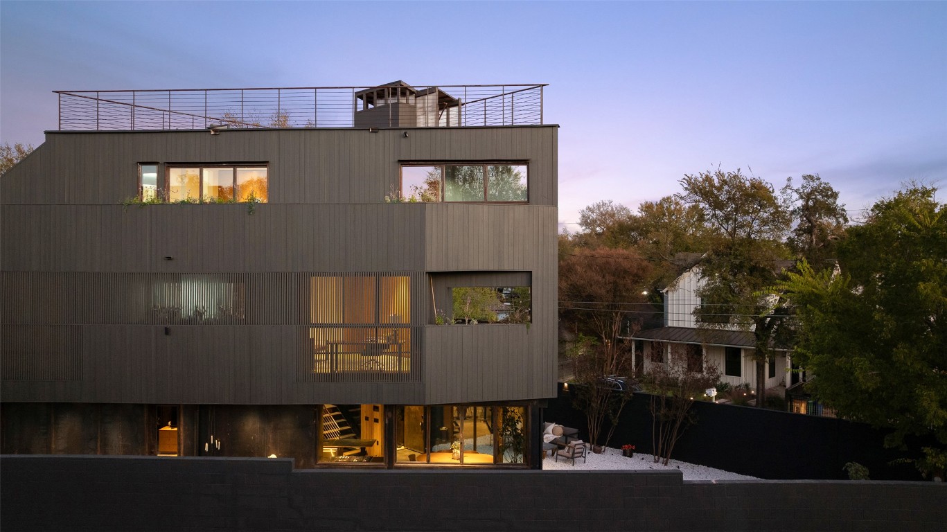 2302 East 11th Street Austin, TX 78702 - Photo 3 of 40 a view of a large building with many windows and yard
