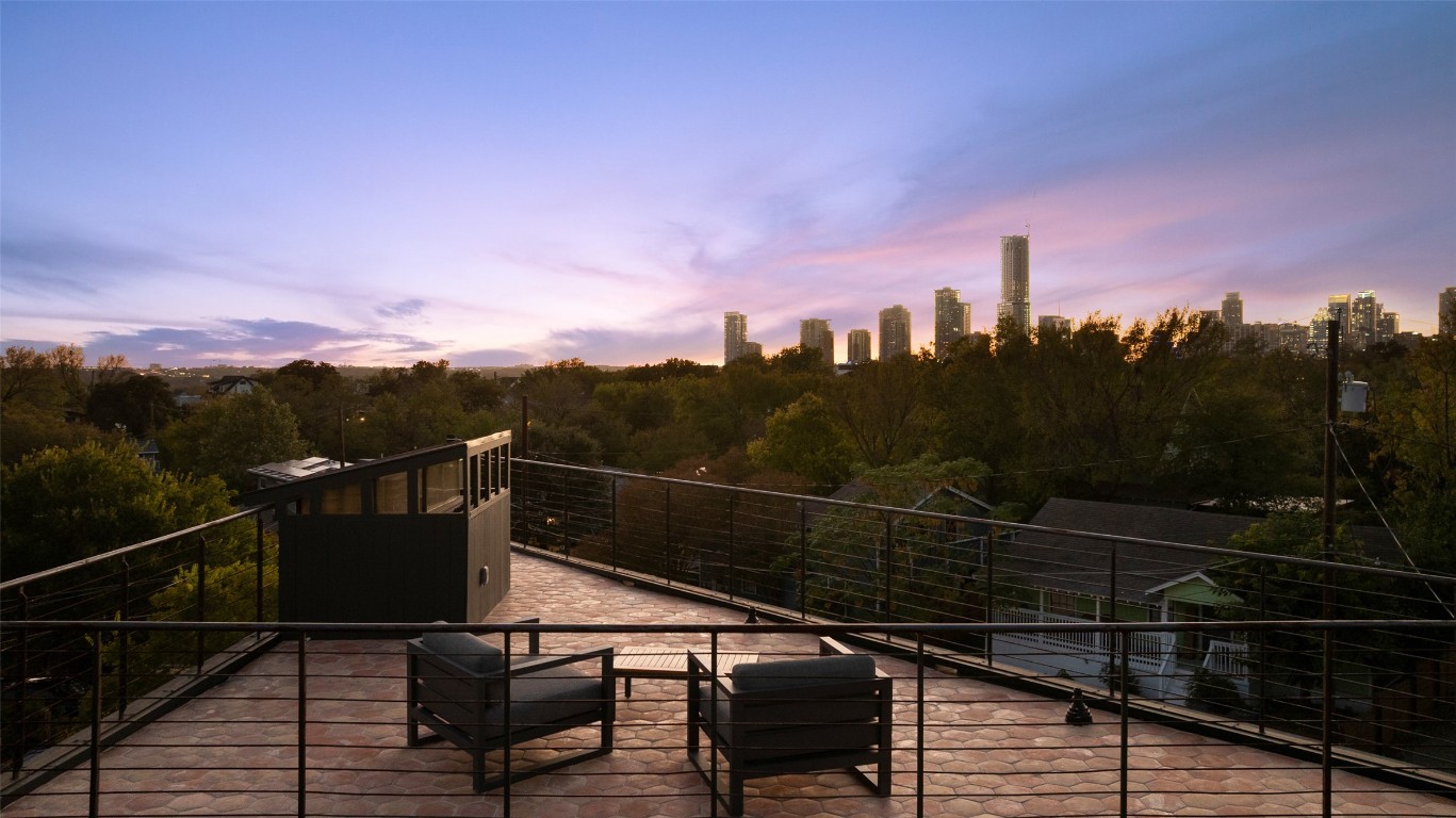 2302 East 11th Street Austin, TX 78702 - Photo 5 of 40 a view of a balcony with wooden floor and city view