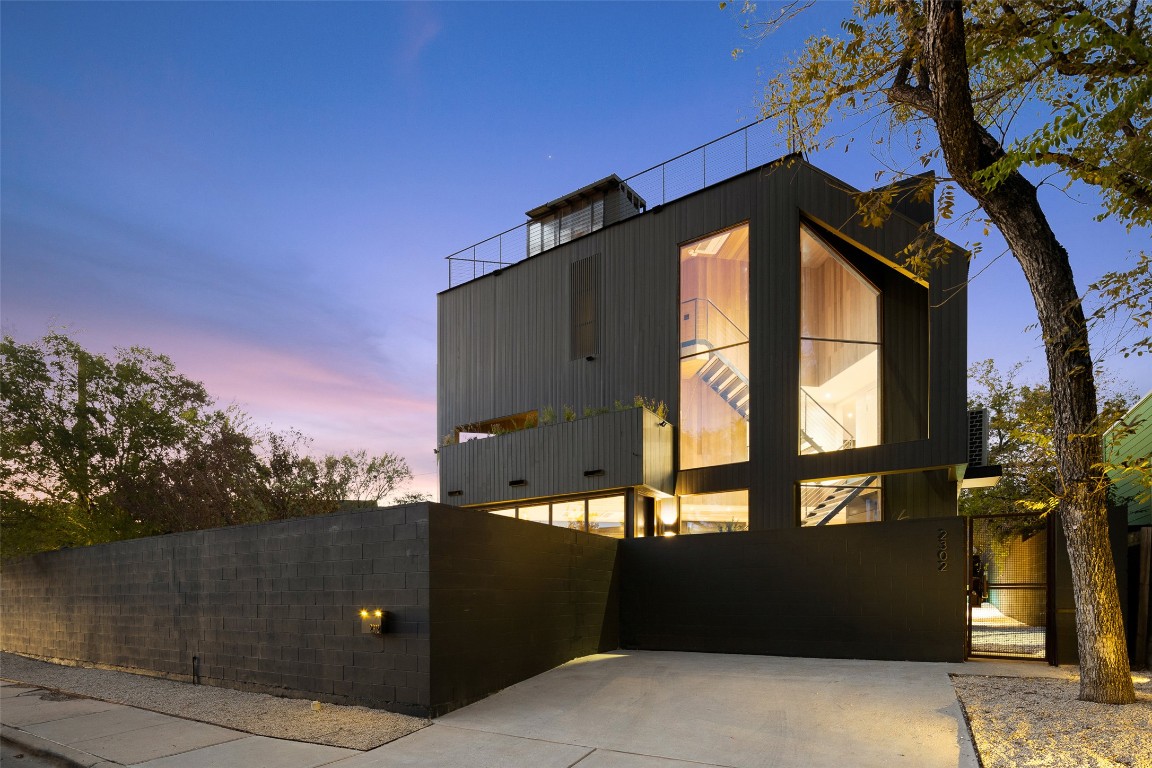 2302 East 11th Street Austin, TX 78702 - Photo 6 of 40 a front view of a house with a yard