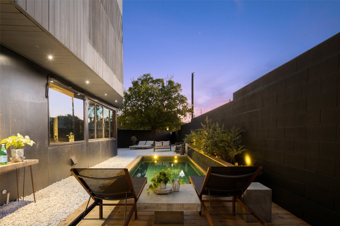 2302 East 11th Street Austin, TX 78702 - Photo 7 of 40 a swimming pool with outdoor seating and yard