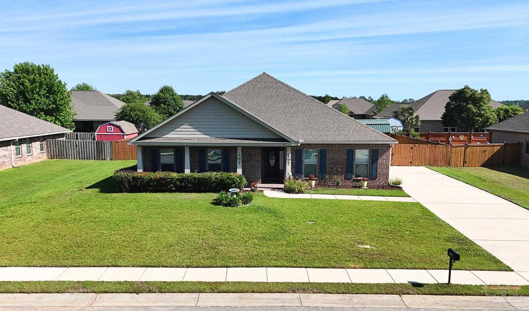a front view of a house with a garden and porch