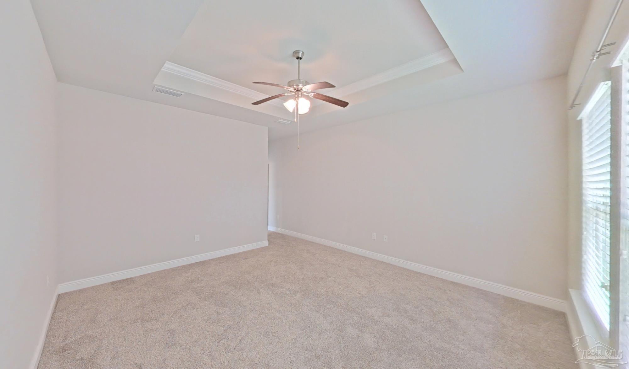 633 Harahan Lane Foley, AL 36535 - Photo 19 of 57 an empty room with windows and fan