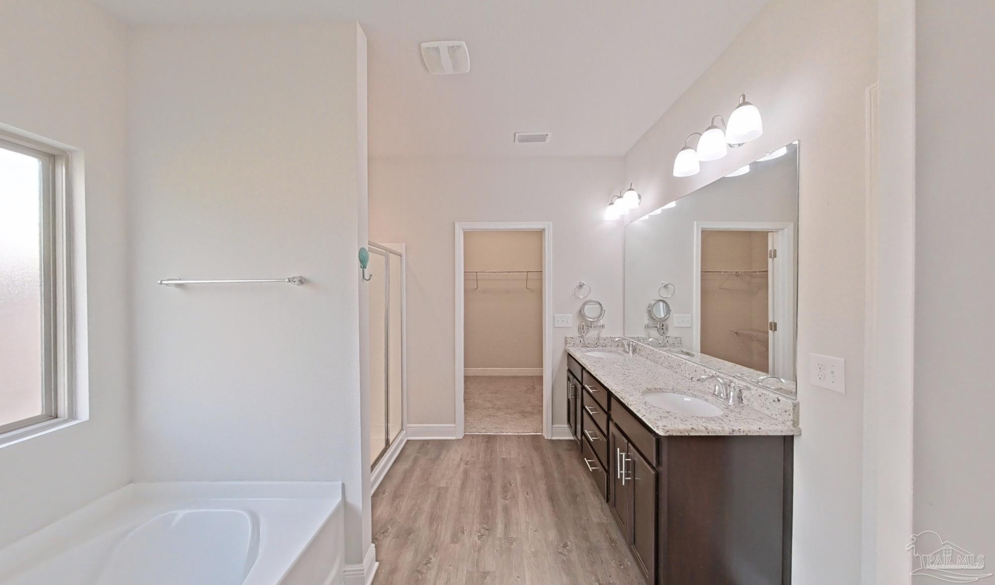 633 Harahan Lane Foley, AL 36535 - Photo 24 of 57 a bathroom with a tub sink and a mirror