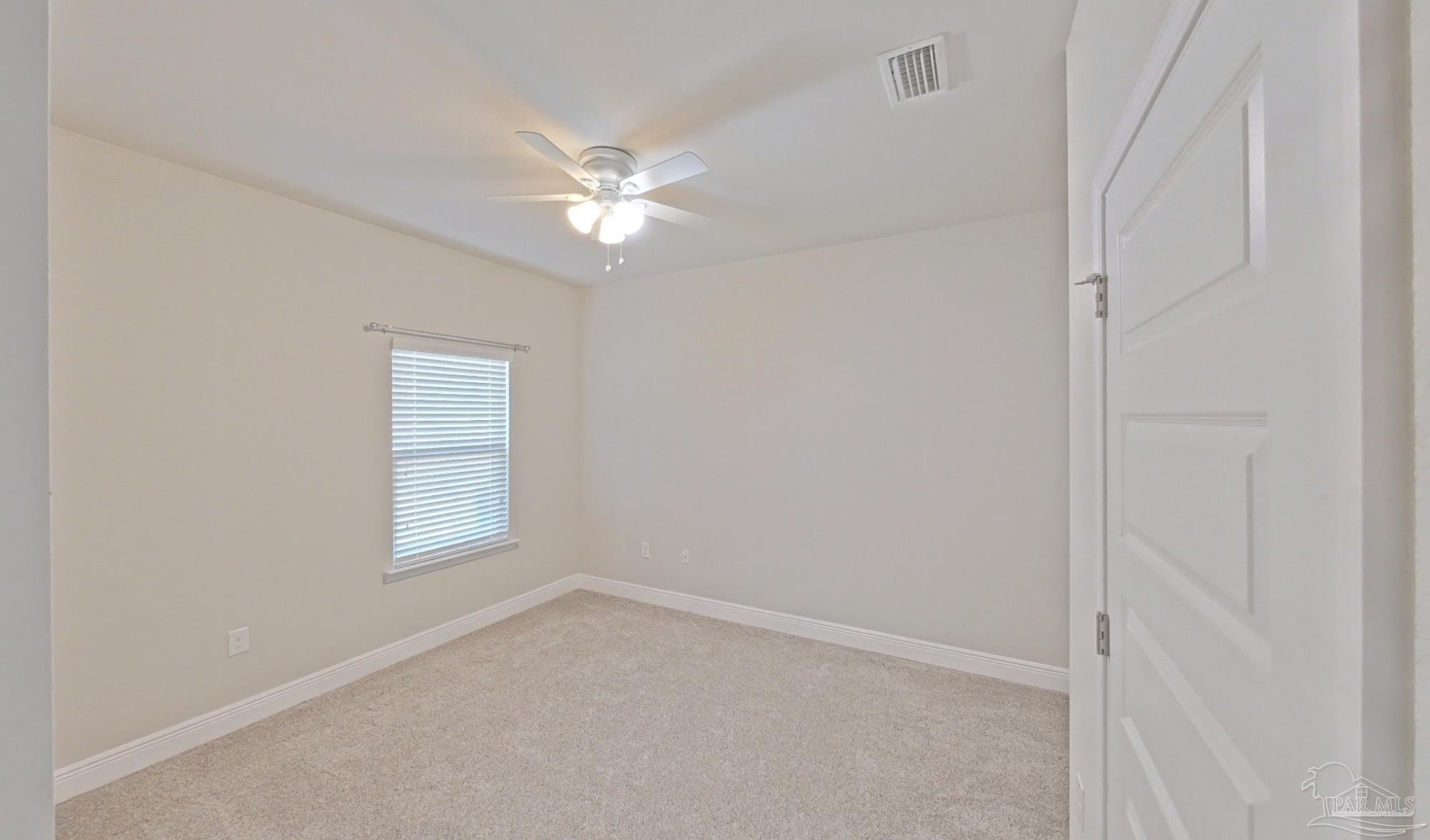 633 Harahan Lane Foley, AL 36535 - Photo 33 of 57 an empty room with windows and fan
