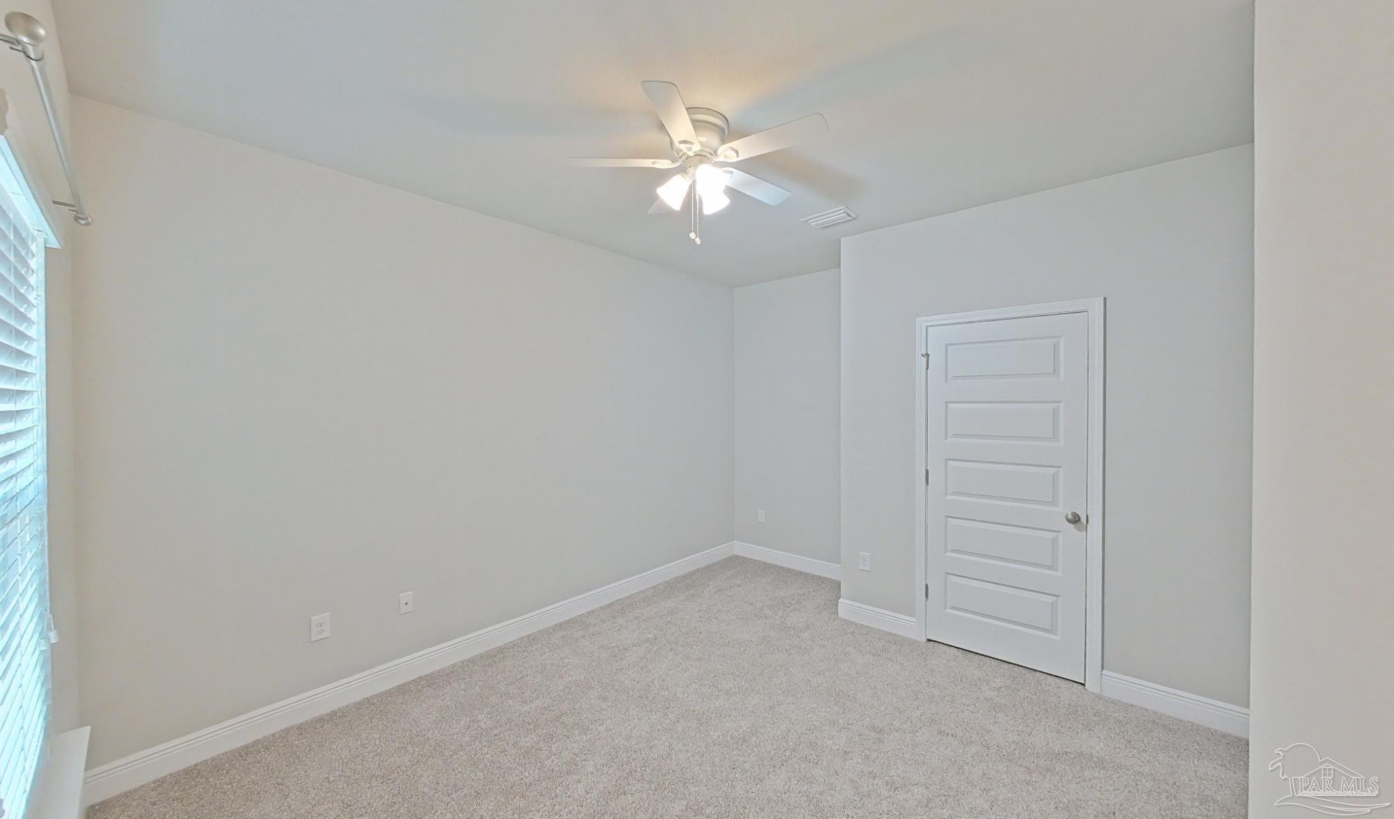 633 Harahan Lane Foley, AL 36535 - Photo 35 of 57 an empty room with closet and a chandelier fan