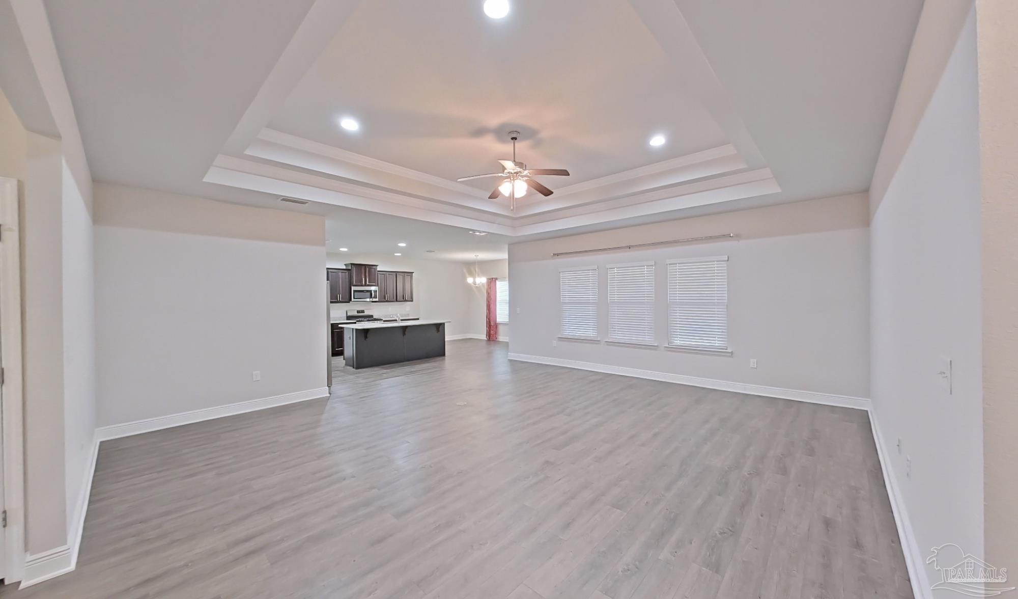 633 Harahan Lane Foley, AL 36535 - Photo 4 of 57 wooden floor in an empty room with a kitchen