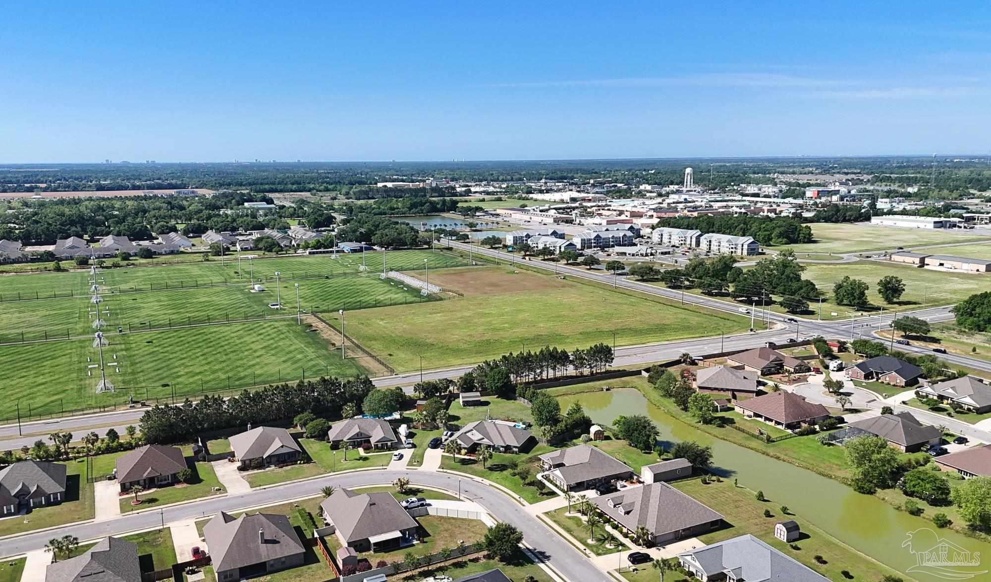 633 Harahan Lane Foley, AL 36535 - Photo 56 of 57 an aerial view of a city with lots of residential buildings ocean and mountain view in back