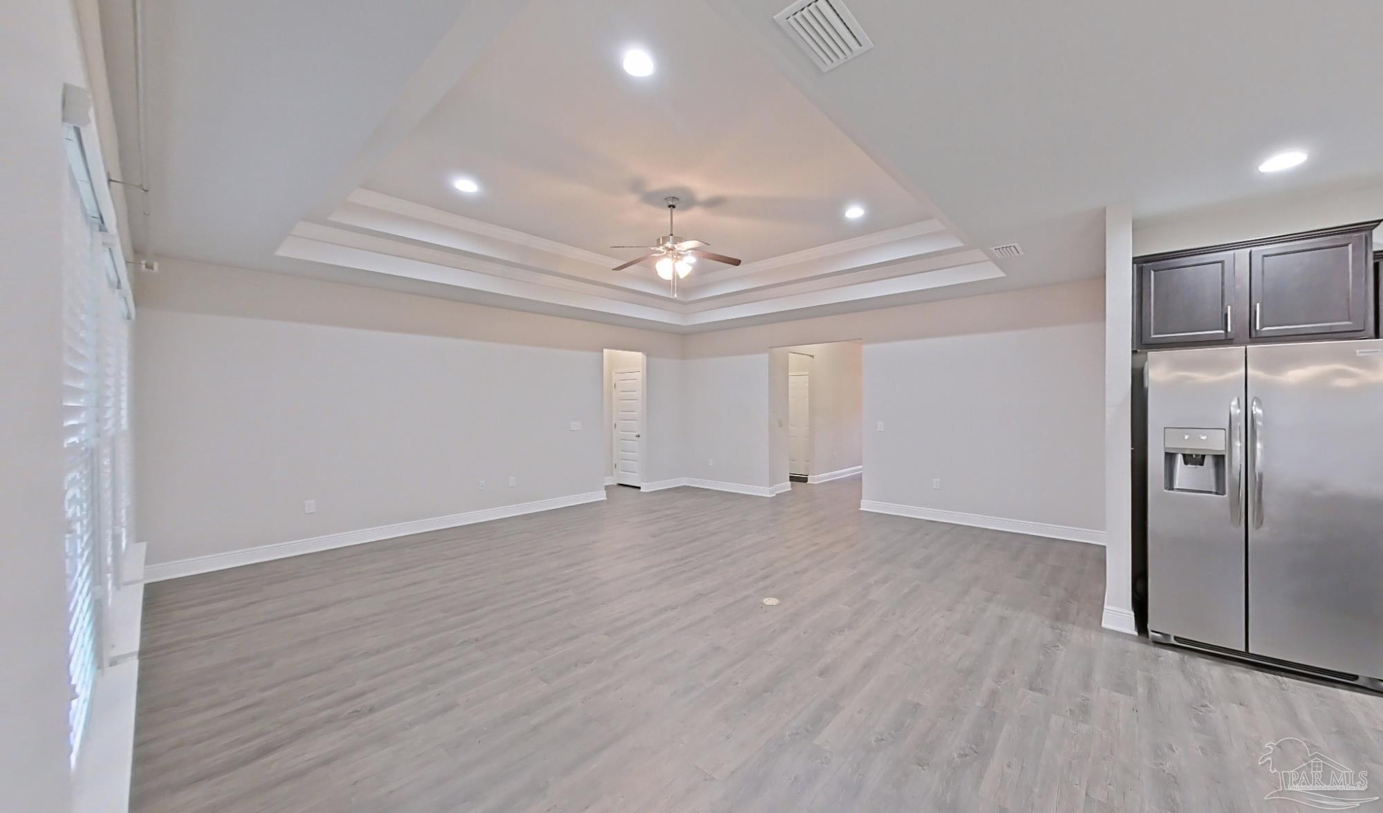 633 Harahan Lane Foley, AL 36535 - Photo 7 of 57 an empty room with wooden floor and windows
