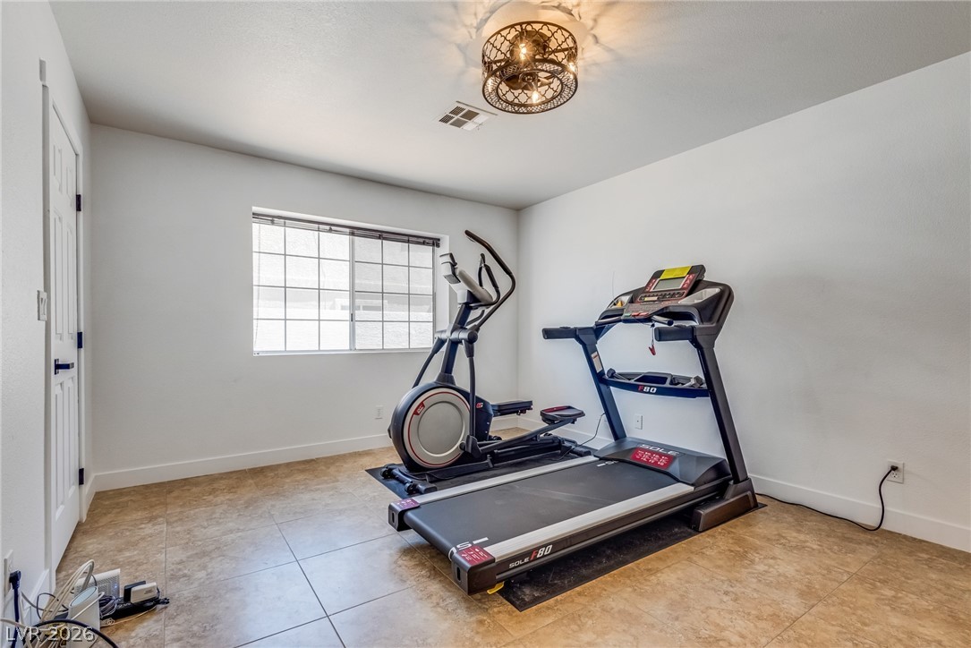 524 Swallow Cove Boulder City, NV 89005 - Photo 27 of 58 A private space for fitness, complete with tiled flooring and ample natural light.