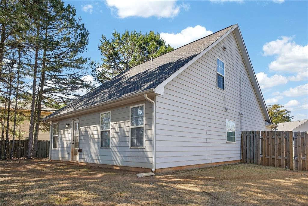 175 Gross Lake Parkway Covington, GA 30016 - Photo 24 of 25 a view of a house with a backyard