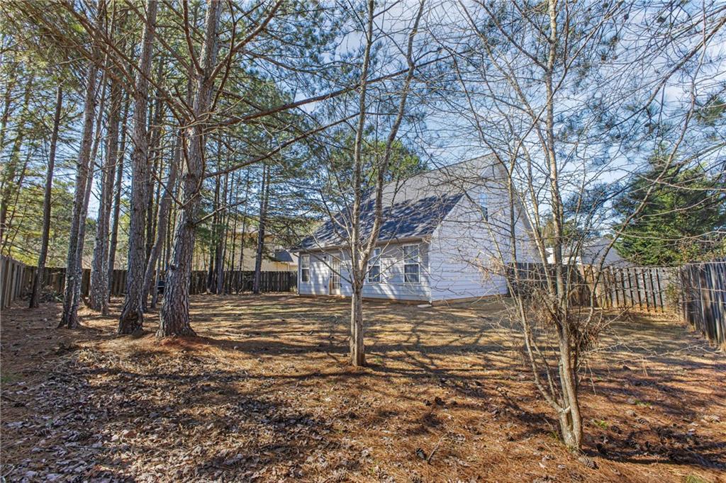 175 Gross Lake Parkway Covington, GA 30016 - Photo 25 of 25 a view of a yard with trees