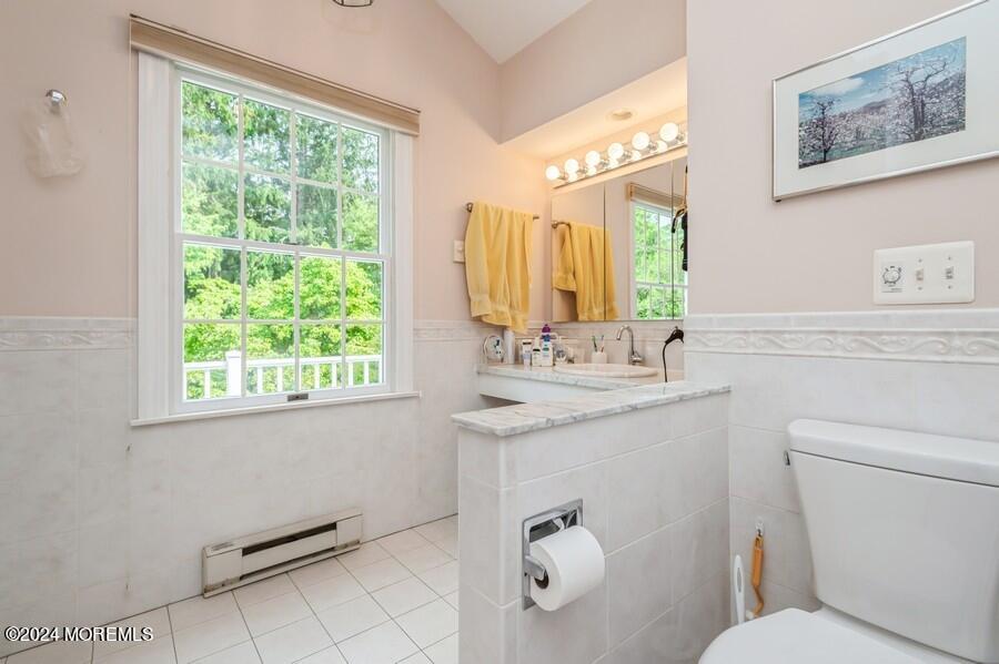 33 Bucks Mill Road Colts Neck, NJ 07722 - Photo 20 of 33 a bathroom with a granite countertop toilet sink and mirror