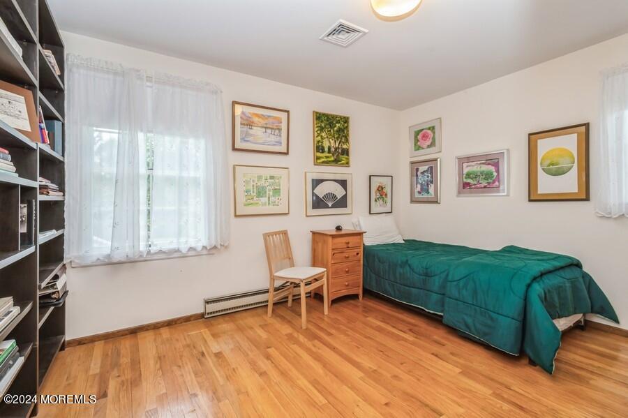 33 Bucks Mill Road Colts Neck, NJ 07722 - Photo 21 of 33 a living room with furniture and paintings on the wall