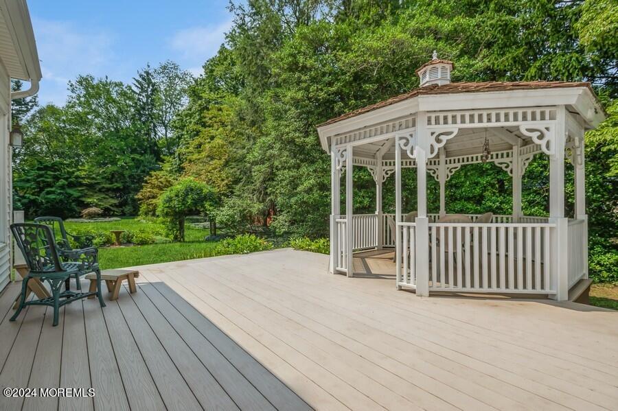 33 Bucks Mill Road Colts Neck, NJ 07722 - Photo 3 of 33 a view of a wooden deck with a yard