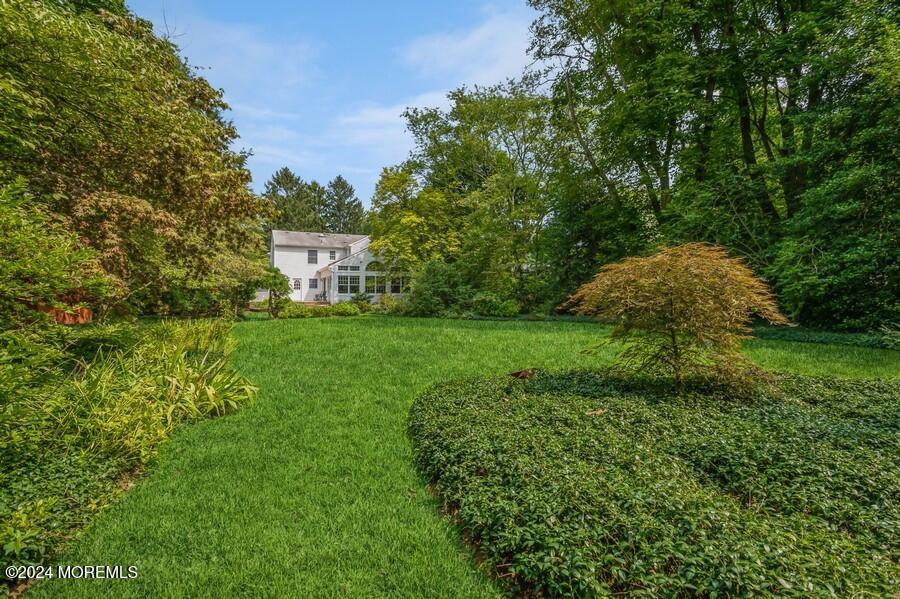 33 Bucks Mill Road Colts Neck, NJ 07722 - Photo 4 of 33 a view of a garden with a house