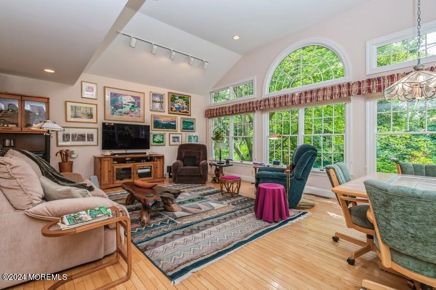 33 Bucks Mill Road Colts Neck, NJ 07722 - Photo 8 of 33 a living room with furniture large window and flat screen tv