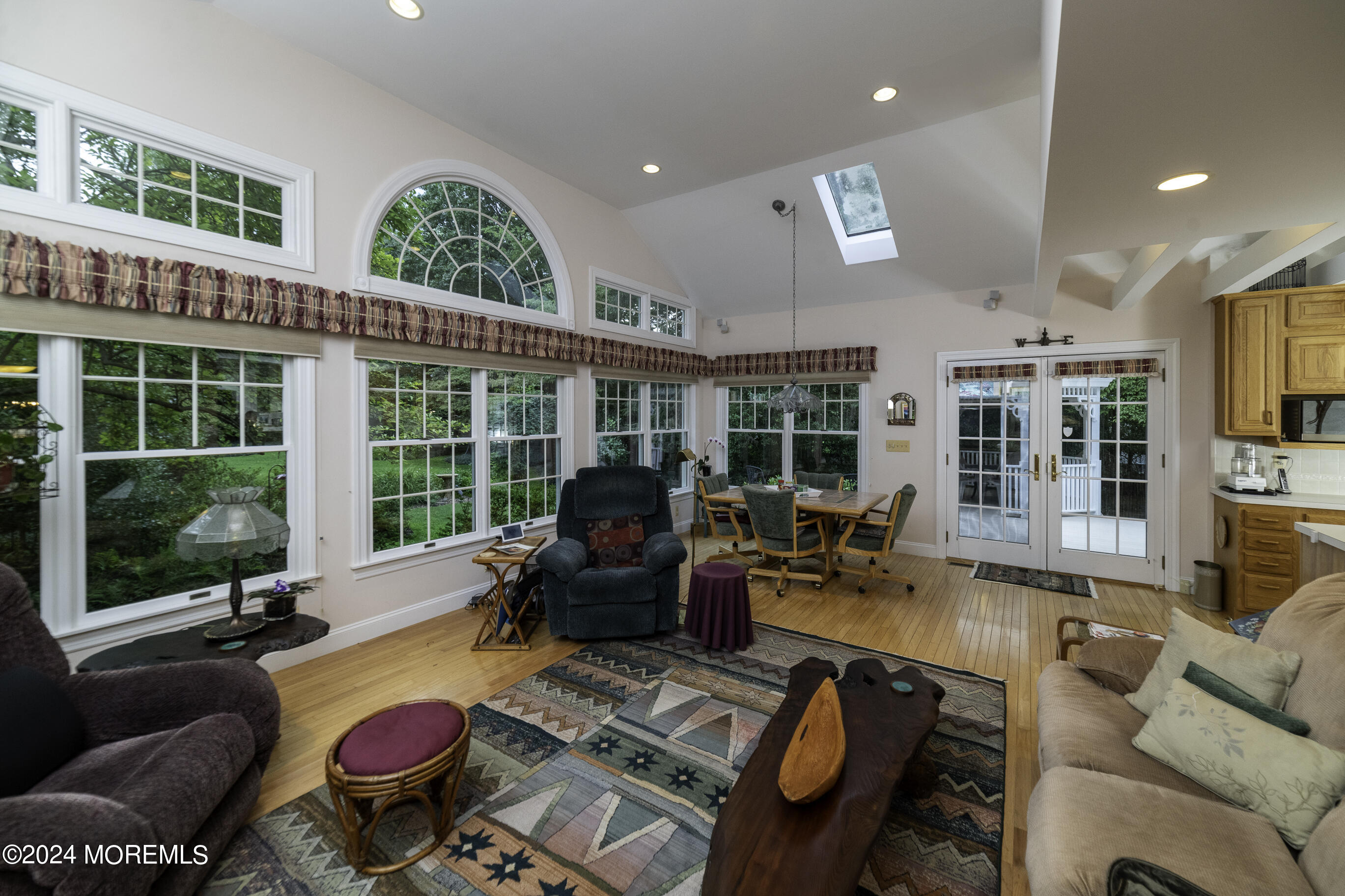 33 Bucks Mill Road Colts Neck, NJ 07722 - Photo 10 of 33 a living room with furniture fireplace and large windows
