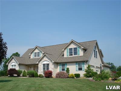 231 Kellington Road Wind Gap, PA 18091 - Photo 1 of 48 a front view of a house with a yard and garage