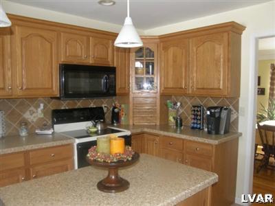 231 Kellington Road Wind Gap, PA 18091 - Photo 16 of 48 a kitchen with a sink a stove and a microwave