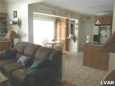 231 Kellington Road Wind Gap, PA 18091 - Photo 19 of 48 a living room with furniture and a chandelier