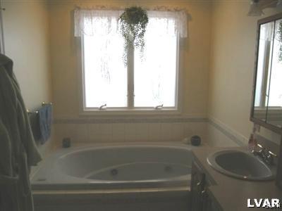 231 Kellington Road Wind Gap, PA 18091 - Photo 25 of 48 a bath tub sitting next to a window