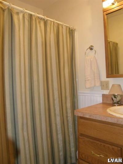 231 Kellington Road Wind Gap, PA 18091 - Photo 31 of 48 a bathroom with a shower curtain and a sink