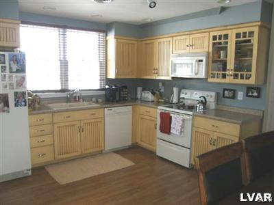 231 Kellington Road Wind Gap, PA 18091 - Photo 38 of 48 a kitchen with white cabinets and white appliances