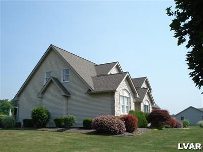231 Kellington Road Wind Gap, PA 18091 - Photo 4 of 48 a front view of a house with a garden and plants