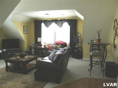 231 Kellington Road Wind Gap, PA 18091 - Photo 41 of 48 a living room with furniture and a floor to ceiling window