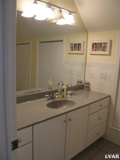 231 Kellington Road Wind Gap, PA 18091 - Photo 44 of 48 a bathroom with a granite countertop sink a mirror and vanity
