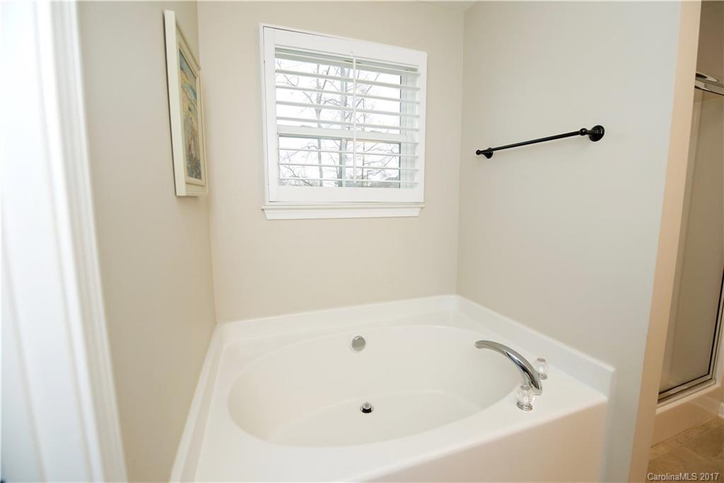 338 Lorraine Road Fort Mill, SC 29708 - Photo 14 of 24 a white bath tub sitting next to a window