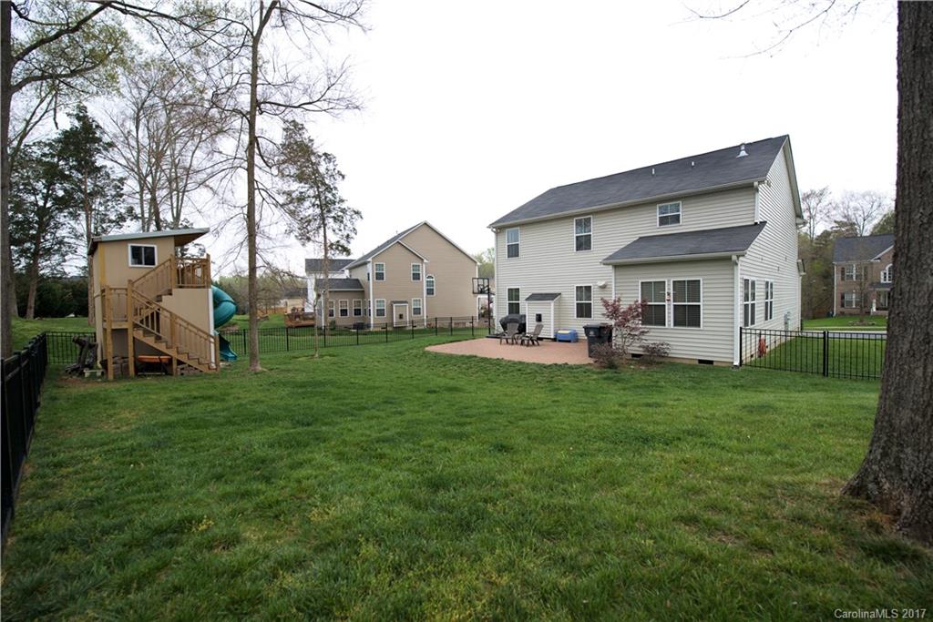 338 Lorraine Road Fort Mill, SC 29708 - Photo 22 of 24 a view of a house with backyard porch and garden