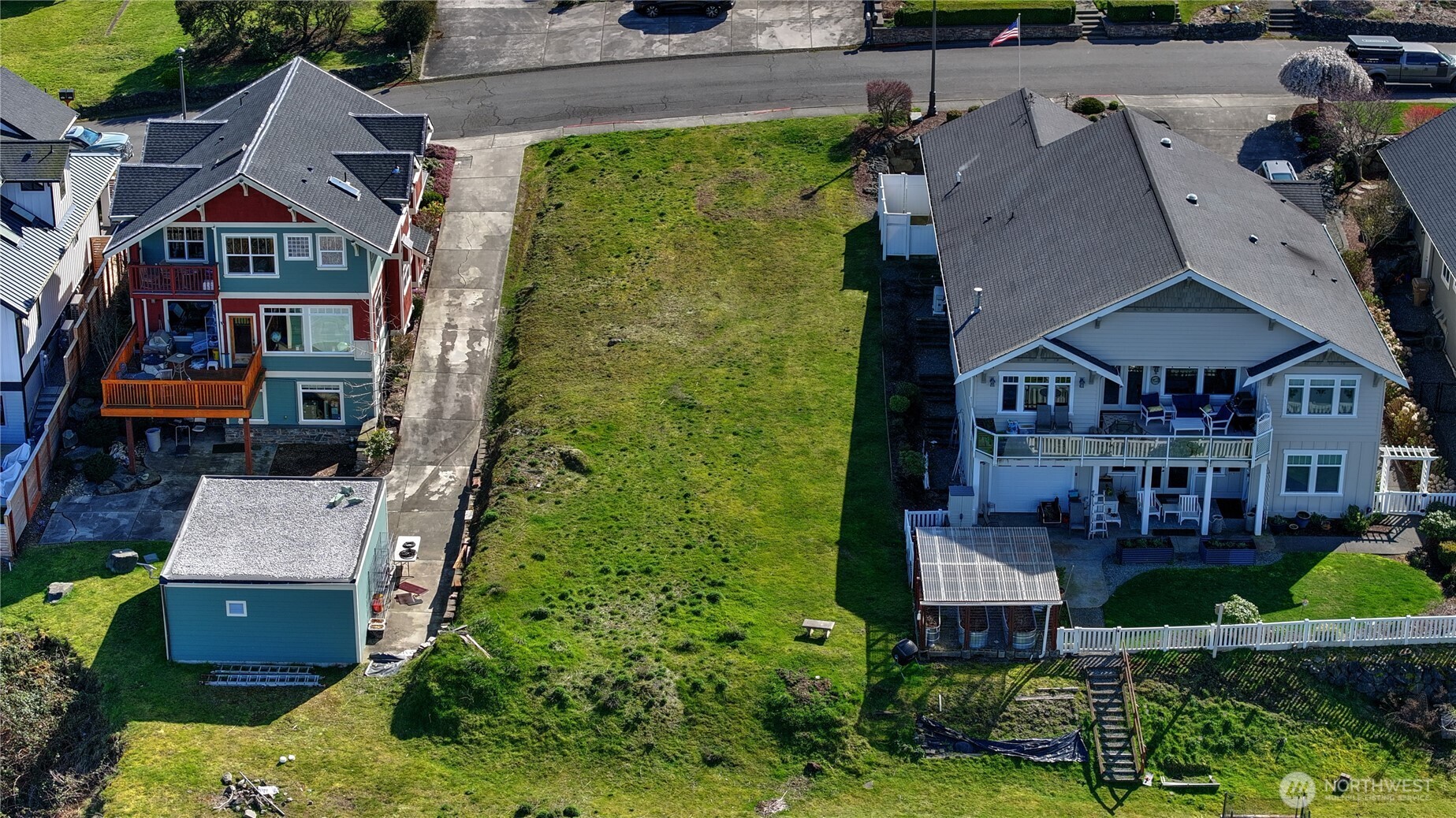 5313 North Commercial Street Ruston, WA 98407 - Photo 15 of 35 an aerial view of multiple houses with a yard