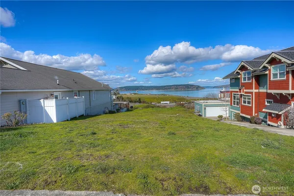 a view of a lake with a yard