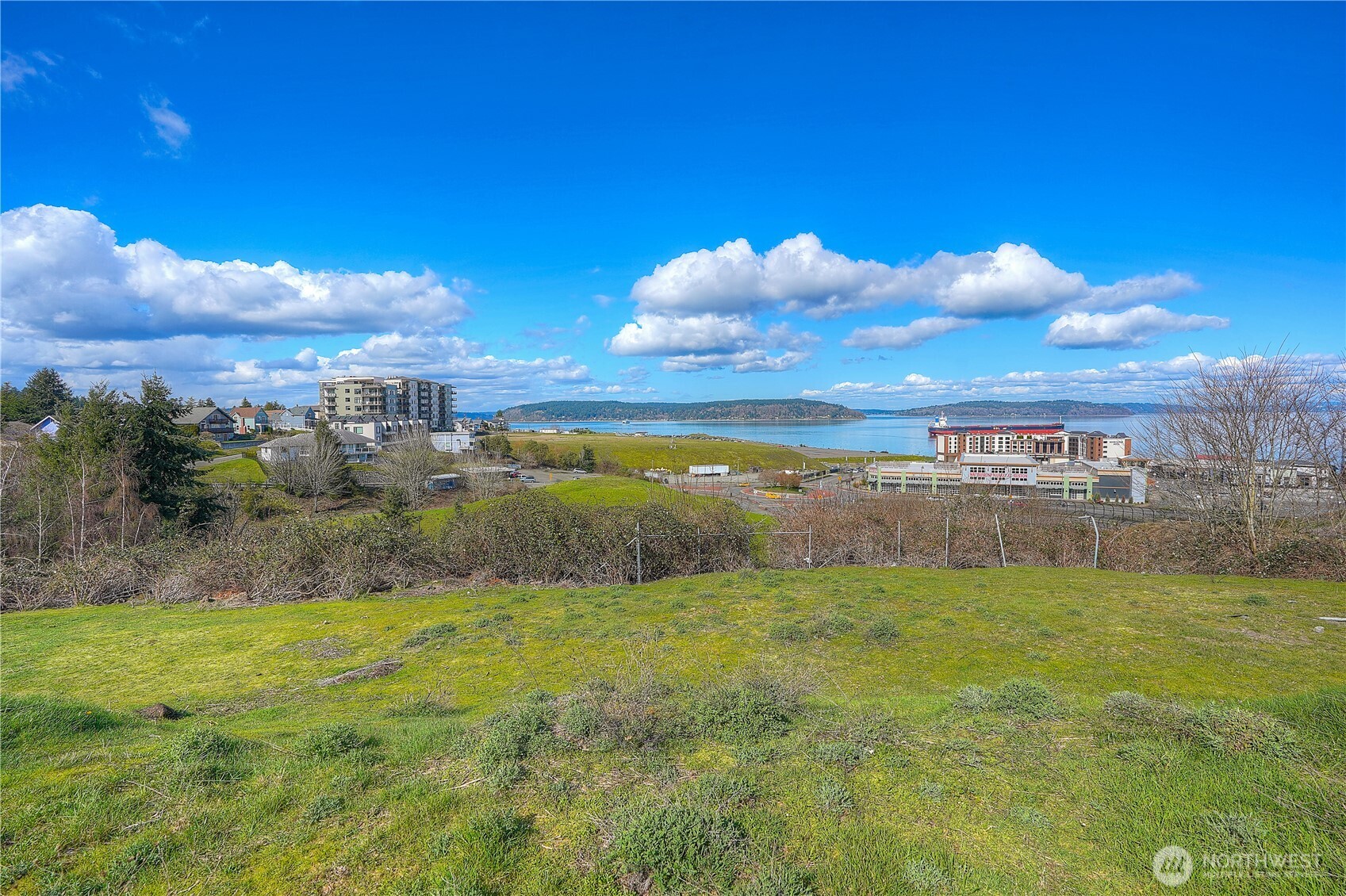 5313 North Commercial Street Ruston, WA 98407 - Photo 30 of 35 a view of a lake with a yard