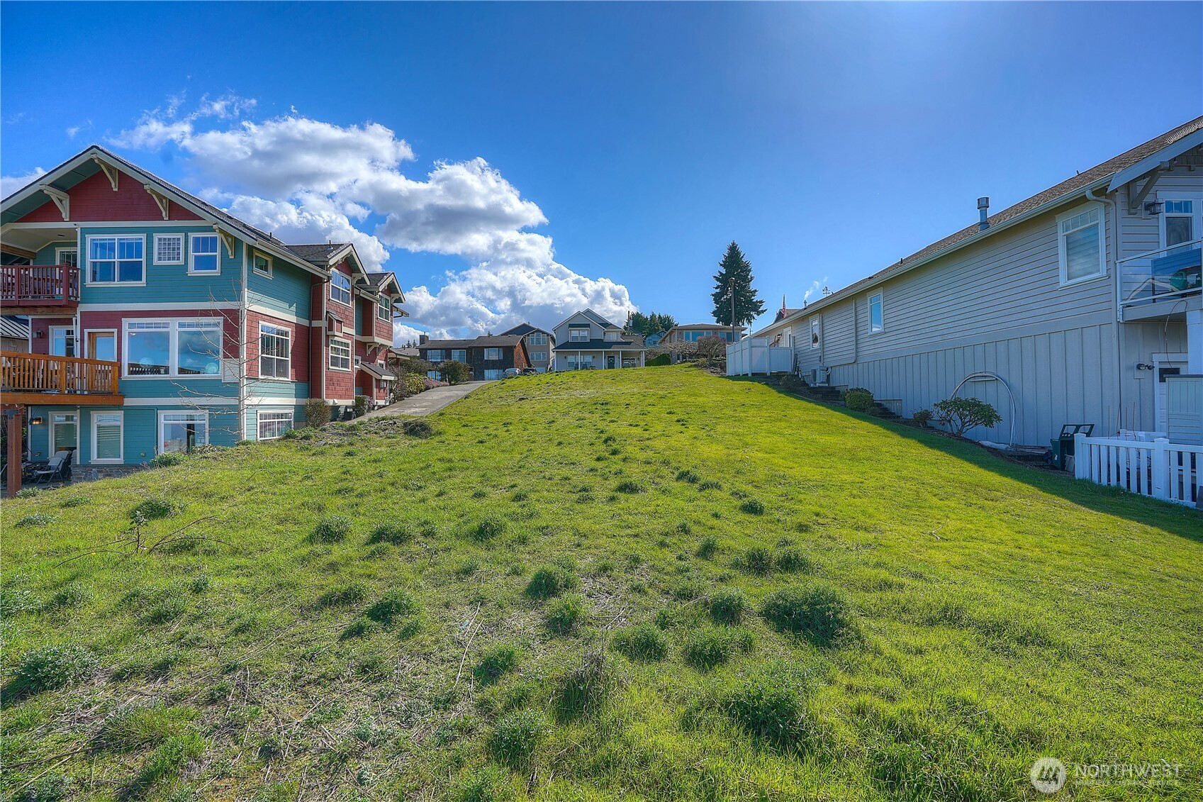 5313 North Commercial Street Ruston, WA 98407 - Photo 34 of 35 a view of a house with a big yard and large trees