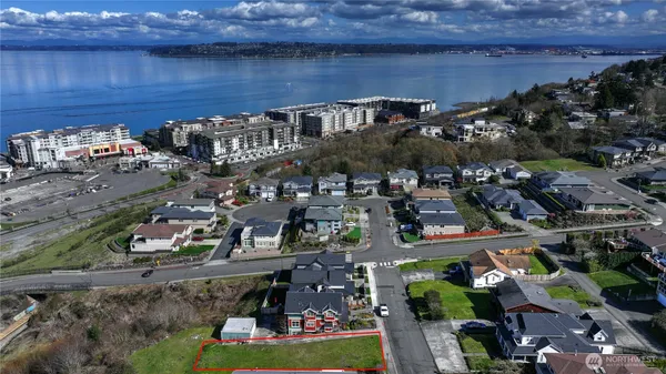 an aerial view of residential house with outdoor space and swimming pool