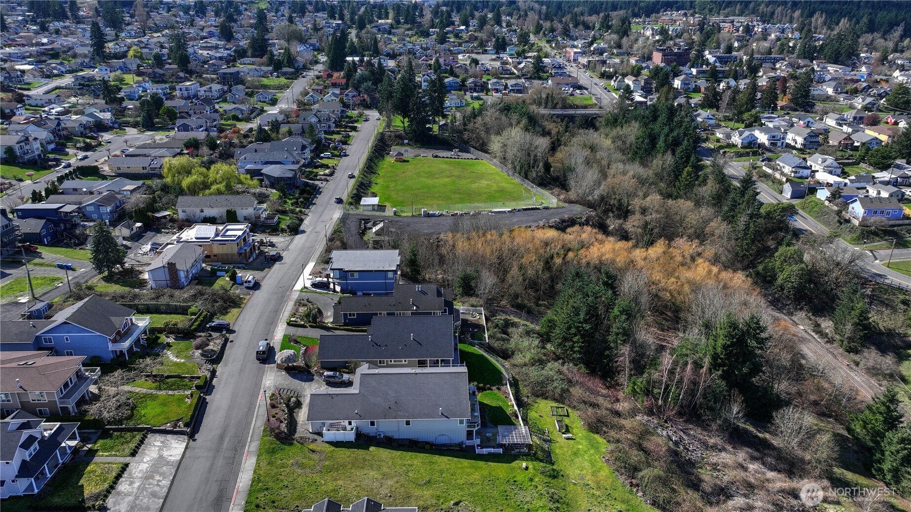 5313 North Commercial Street Ruston, WA 98407 - Photo 8 of 35 an aerial view of residential house with outdoor space and swimming pool