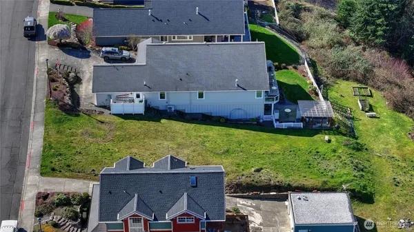 an aerial view of multiple houses with outdoor space