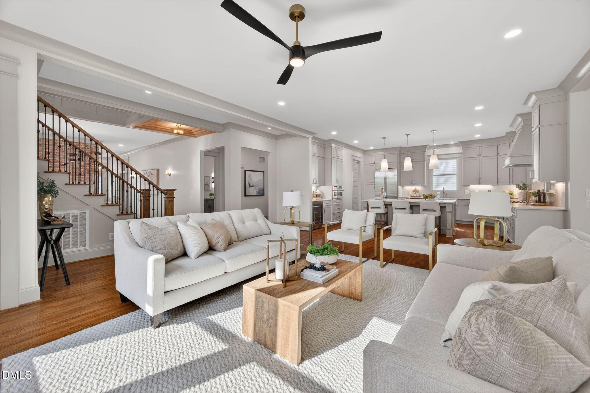 504 Tilden Street Raleigh, NC 27605 - Photo 17 of 58 a living room with furniture kitchen view and a wooden floor