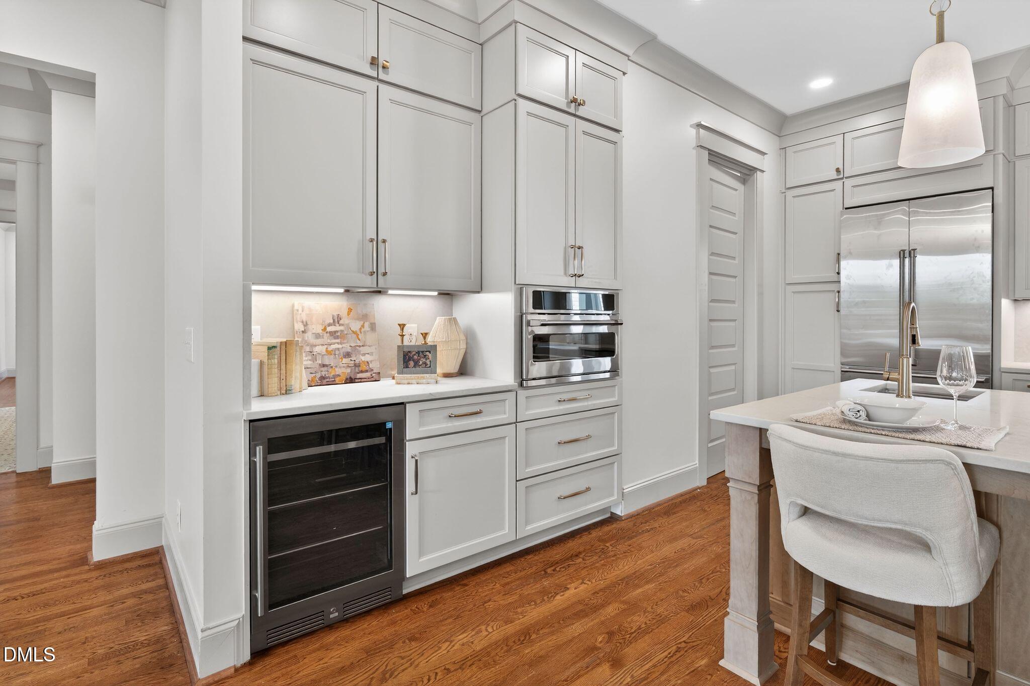 504 Tilden Street Raleigh, NC 27605 - Photo 18 of 58 a kitchen with granite countertop a sink cabinets and wooden floor