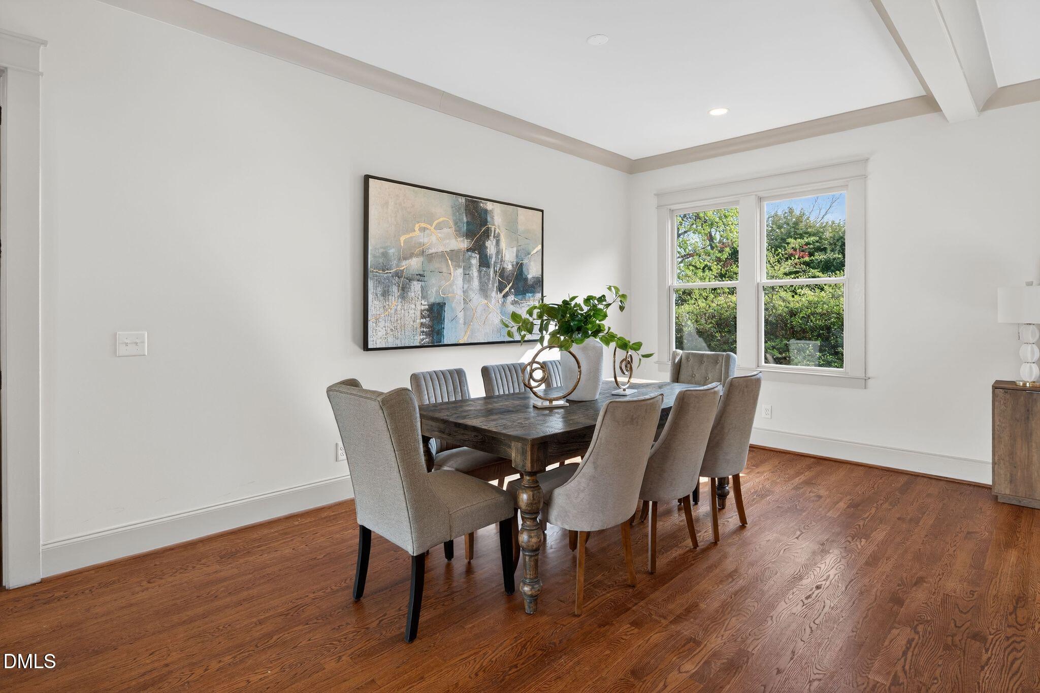 504 Tilden Street Raleigh, NC 27605 - Photo 21 of 58 a view of a dining room with furniture window and wooden floor