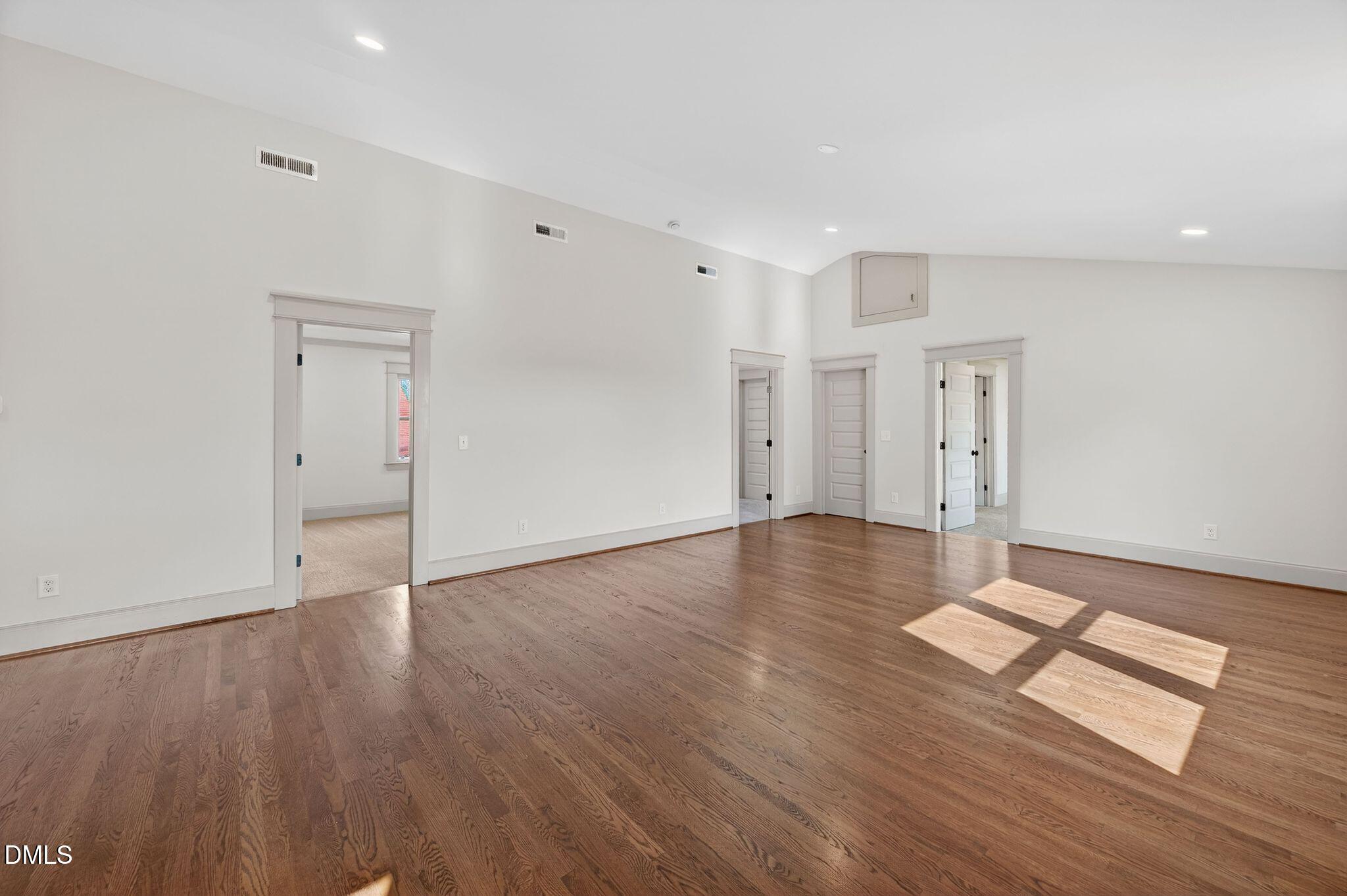 504 Tilden Street Raleigh, NC 27605 - Photo 33 of 58 a view of empty room with wooden floor and window