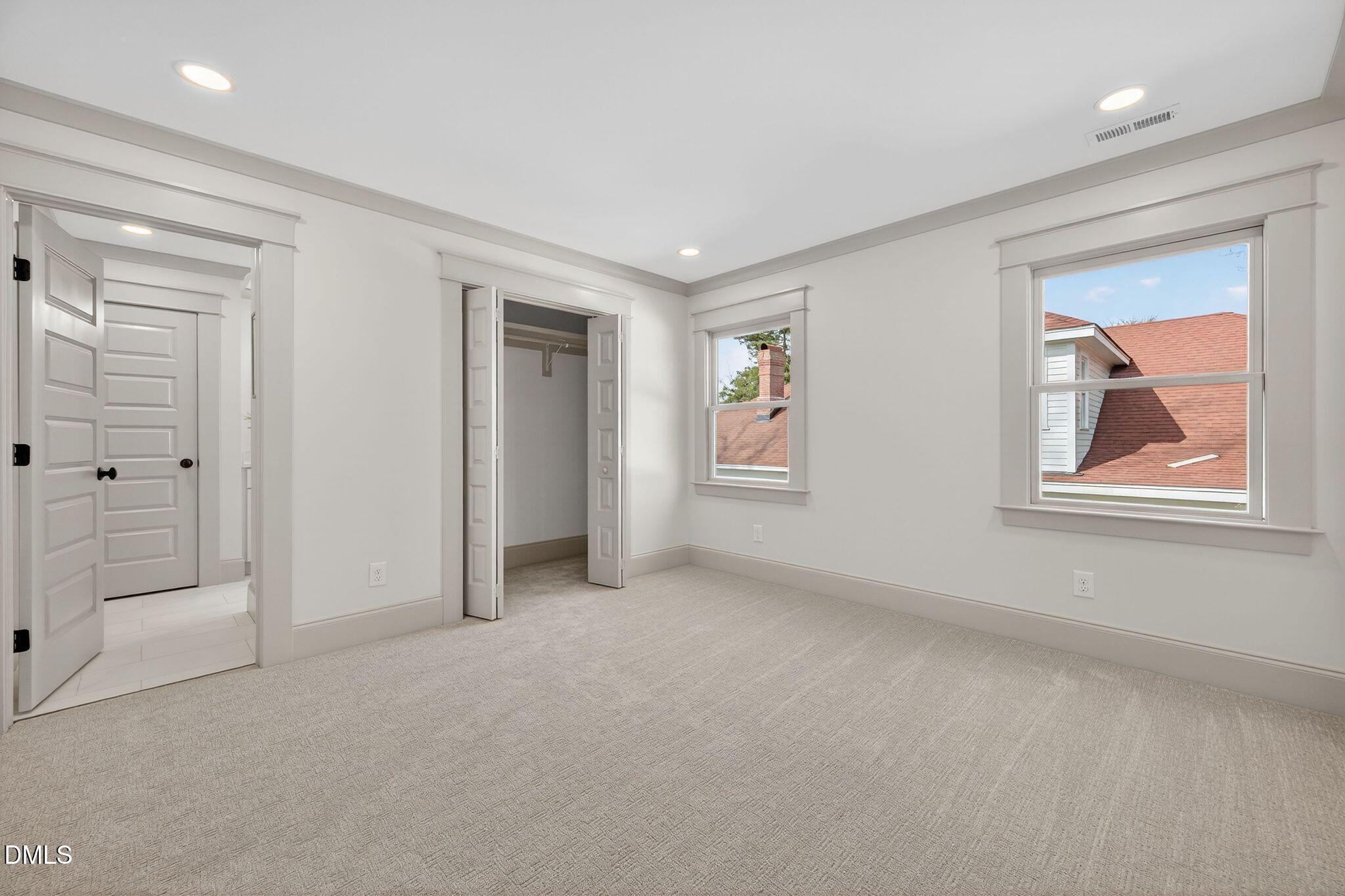 504 Tilden Street Raleigh, NC 27605 - Photo 35 of 58 an empty room with windows and closet