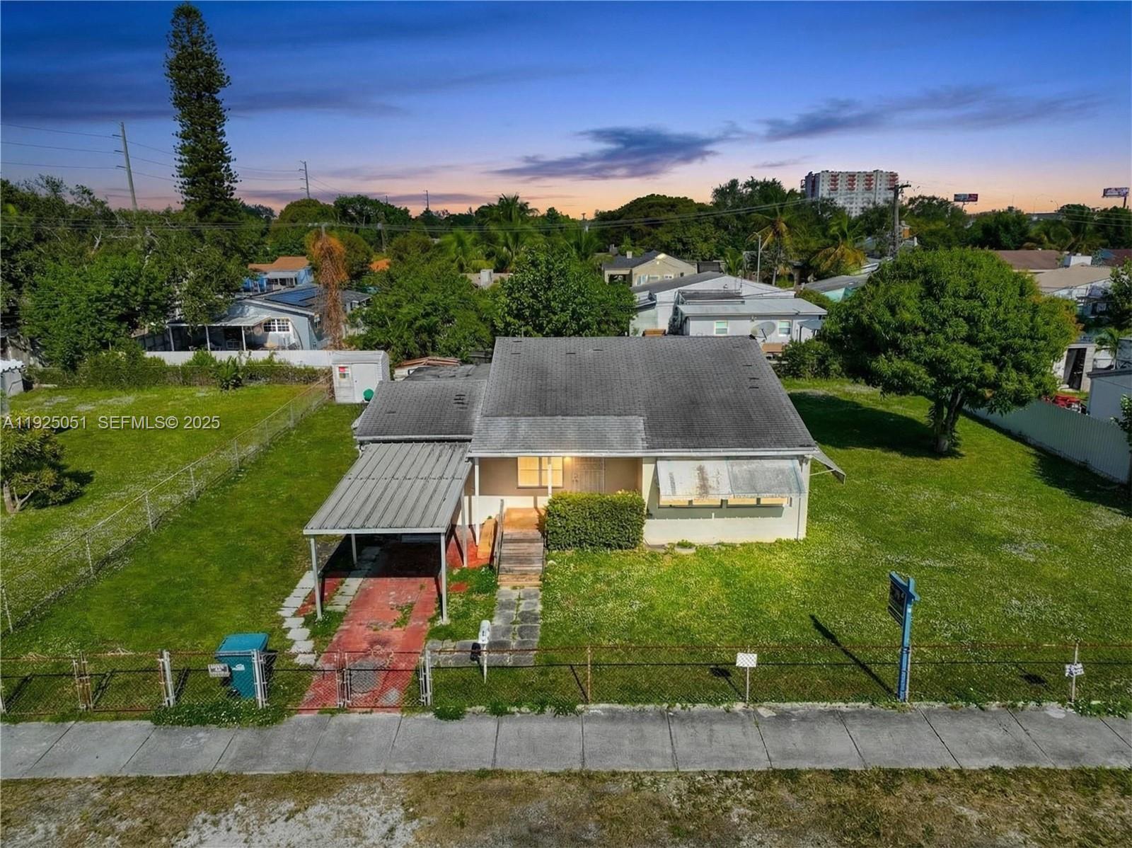 761 Northwest 74th Street Miami, FL 33150 - Photo 4 of 23 an aerial view of residential houses with outdoor space and trees