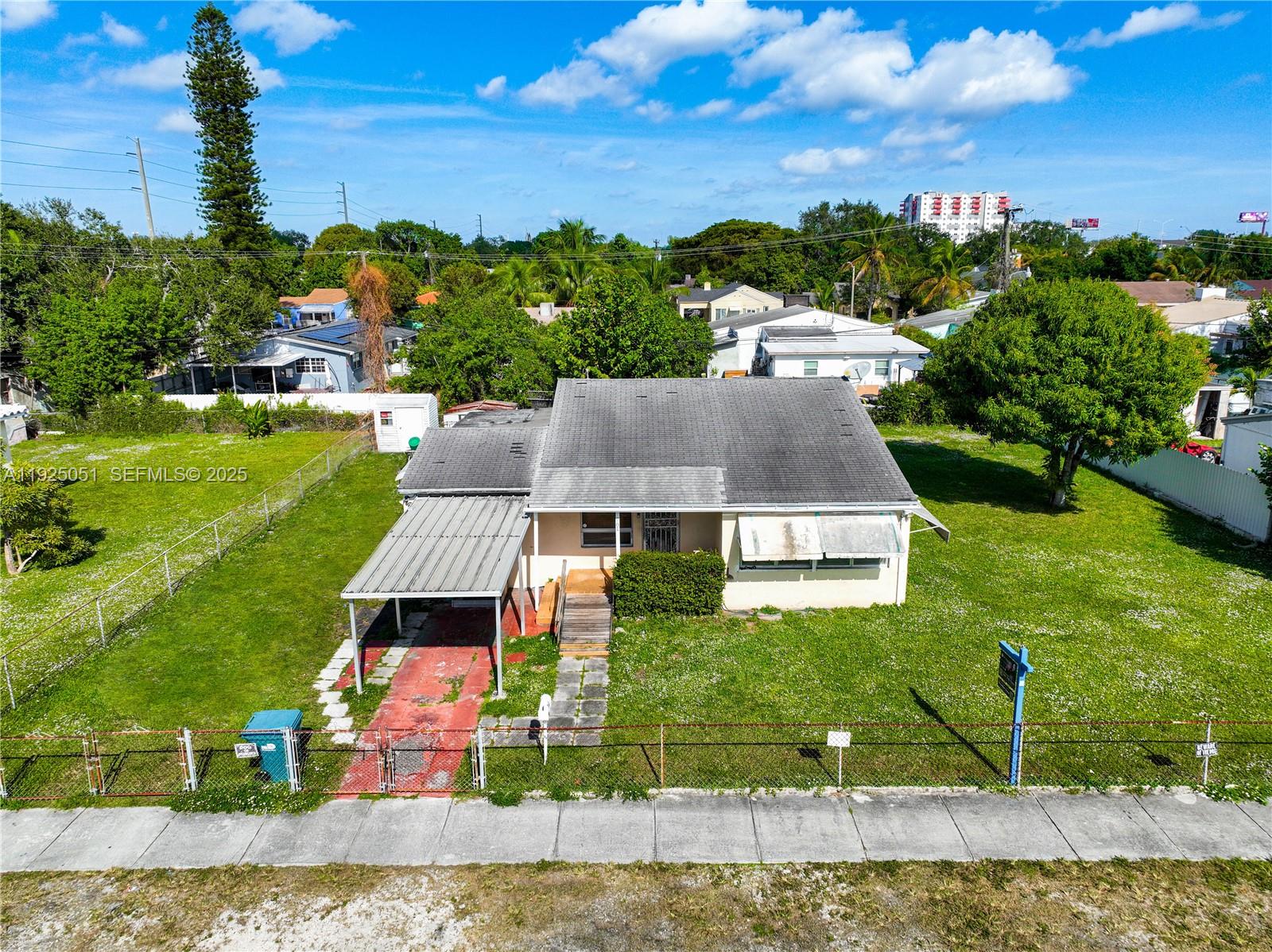 761 Northwest 74th Street Miami, FL 33150 - Photo 5 of 23 an aerial view of residential houses with outdoor space and trees