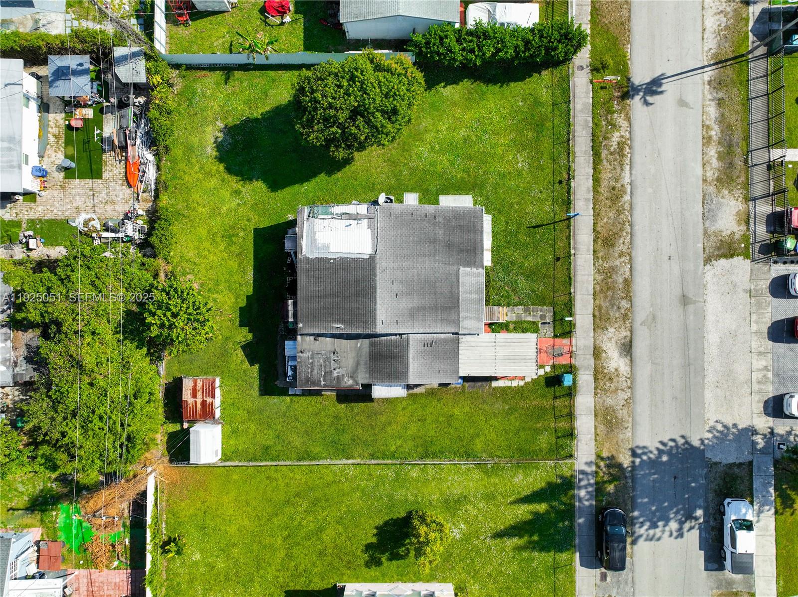 761 Northwest 74th Street Miami, FL 33150 - Photo 6 of 23 a view of a back yard