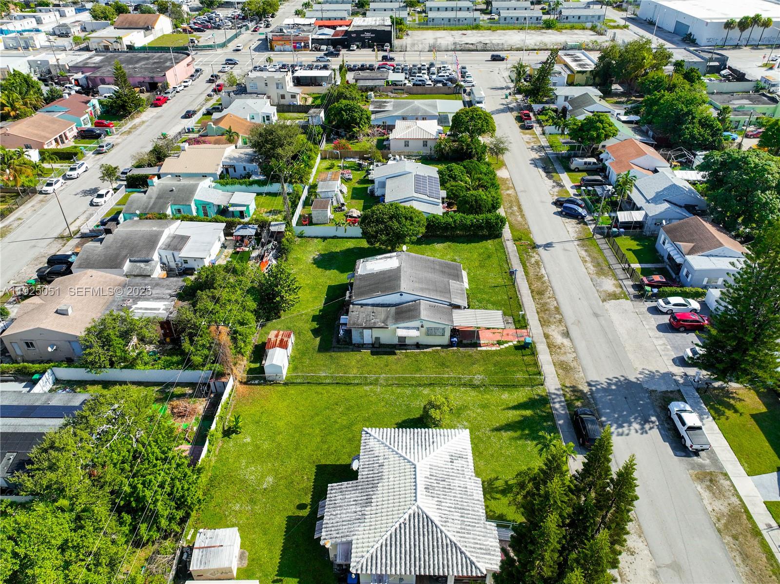 761 Northwest 74th Street Miami, FL 33150 - Photo 10 of 23 an aerial view of a house with a garden