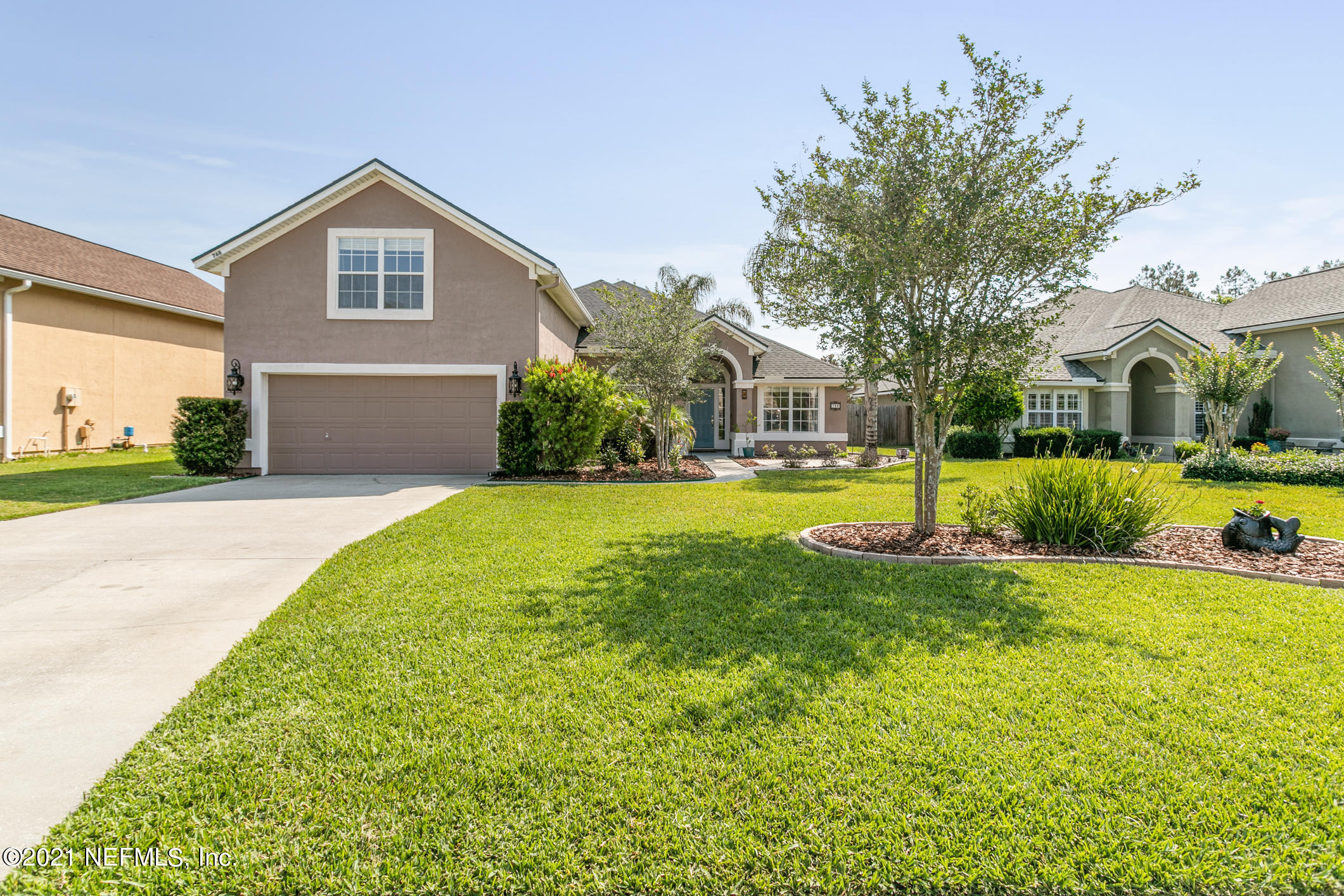 768 West Devonhurst Lane Ponte Vedra, FL 32081 - Photo 1 of 49 a front view of house with yard and green space